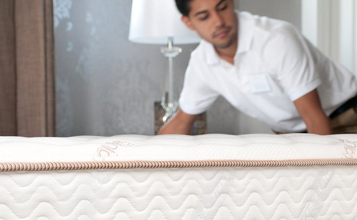image of man moving a mattress