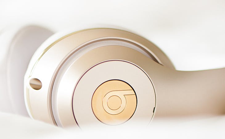 best podcasts for sleep - image of headphones on bed