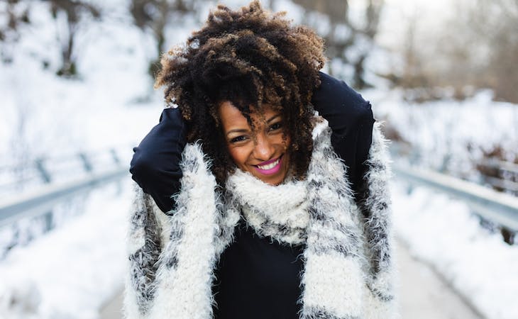 winter sleep tips - image of woman outside in winter getting sunlight