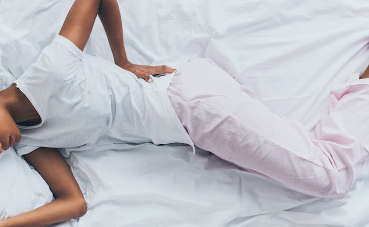 image of person in bed with back pain
