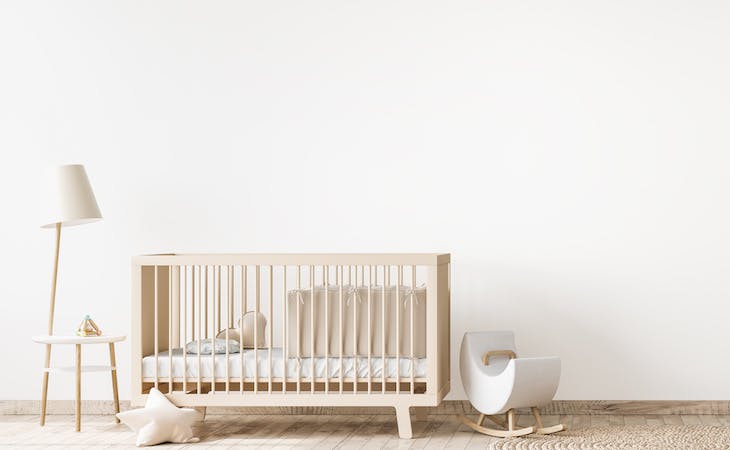 baby nursery with crib in the corner