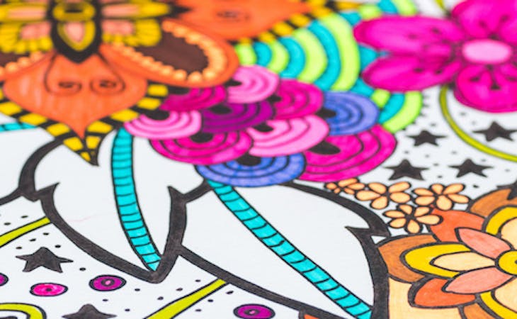 coloring page with markers on top of it