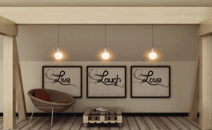 live laugh love posters hanging on bedroom wall