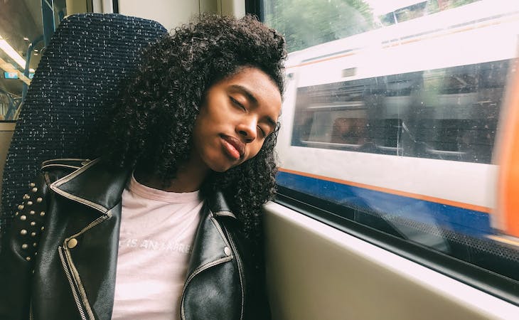person sleeping on a train