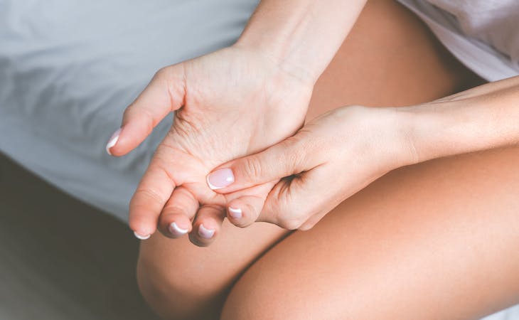 person with numb hands while sleeping