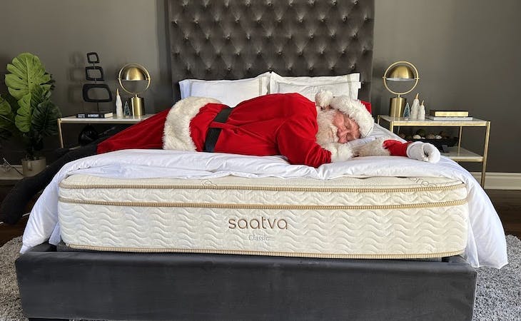 santa claus lying on a saatva mattress