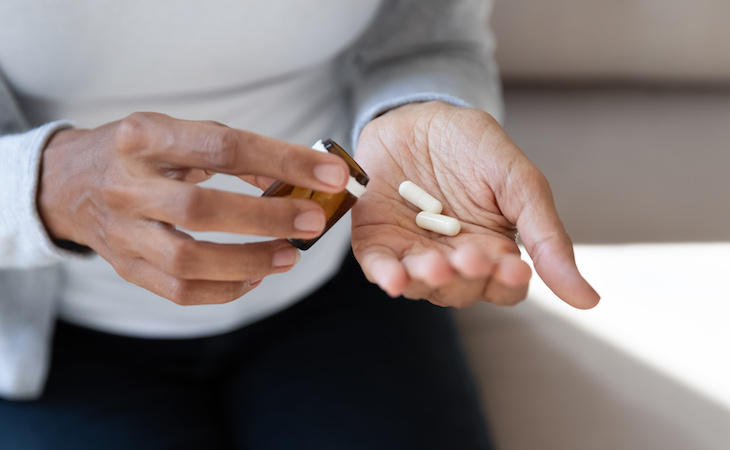 person holding antidepressants in hand