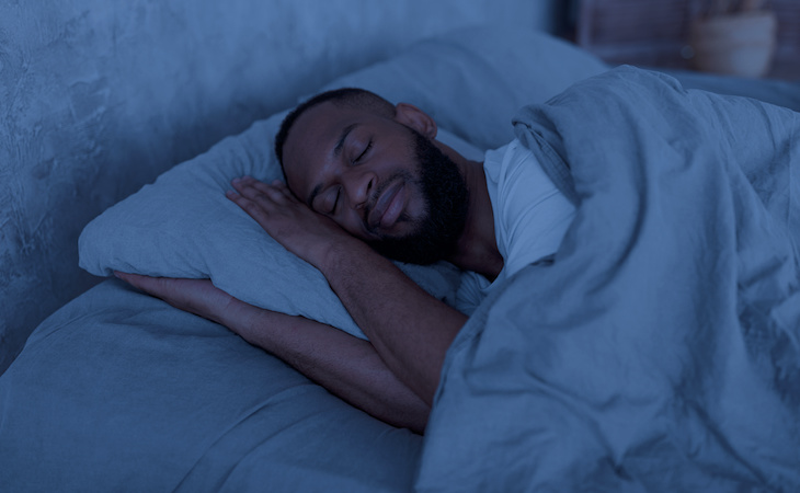 person sleeping on side in bed