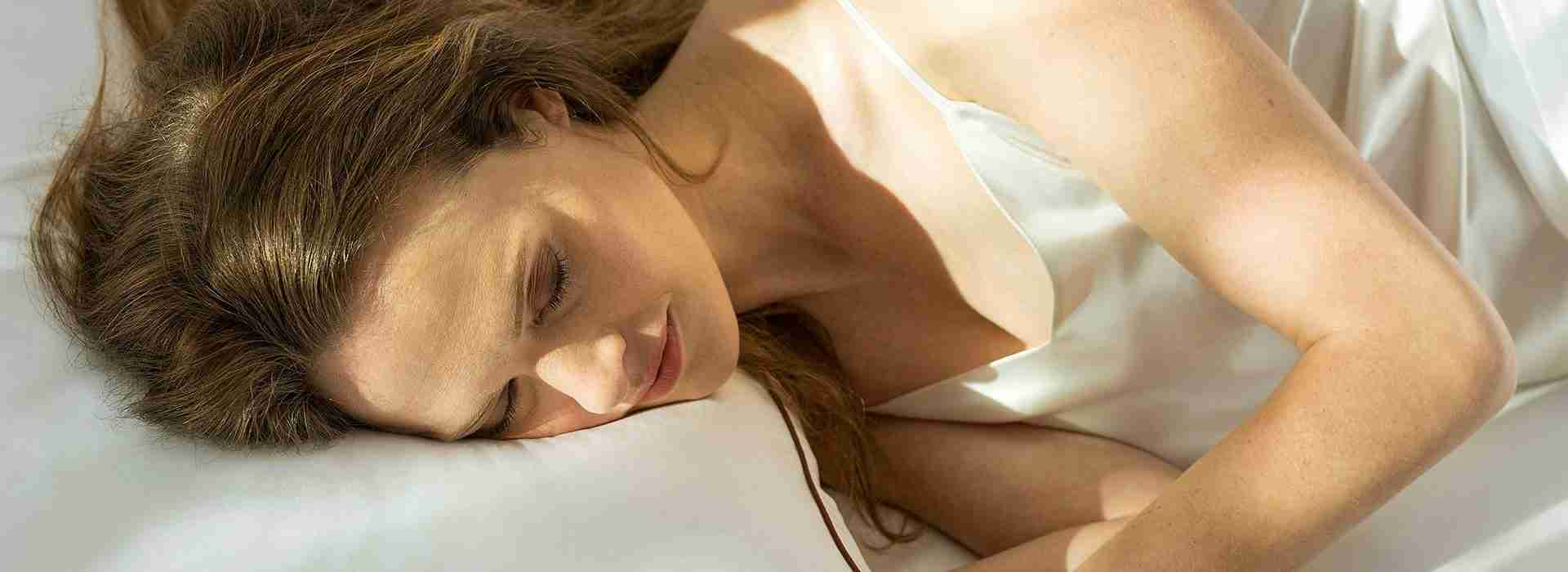 the saatva pillow lifestyle woman sleeping 1 1