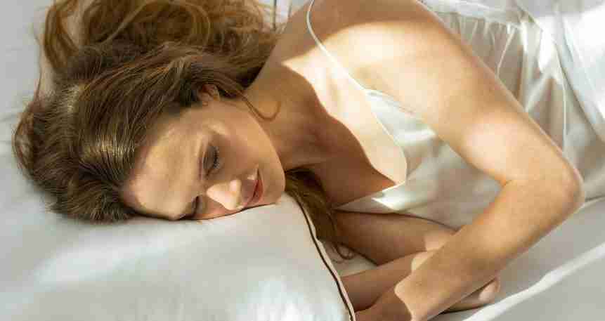 the saatva pillow lifestyle woman sleeping 1 1