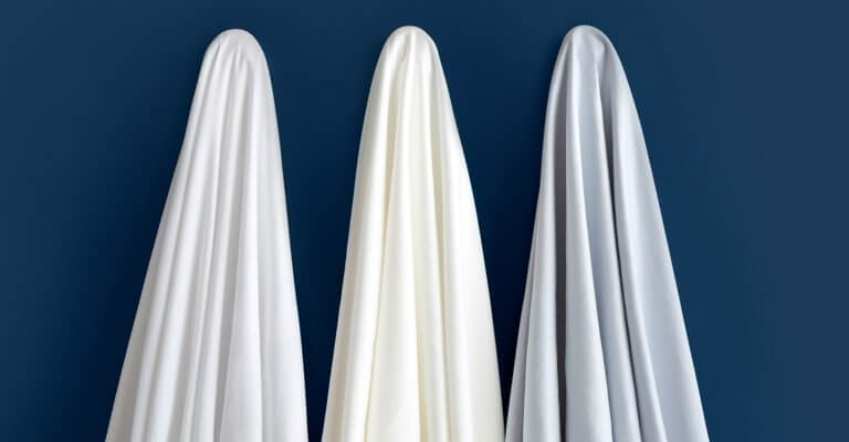 All three colors of Saatva sheets.